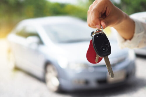 conditional driver's license person with car keys in hand