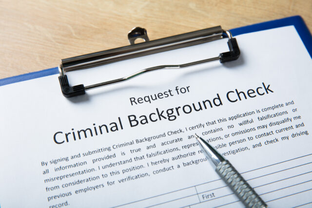 Criminal Background Check Application Form With Pen