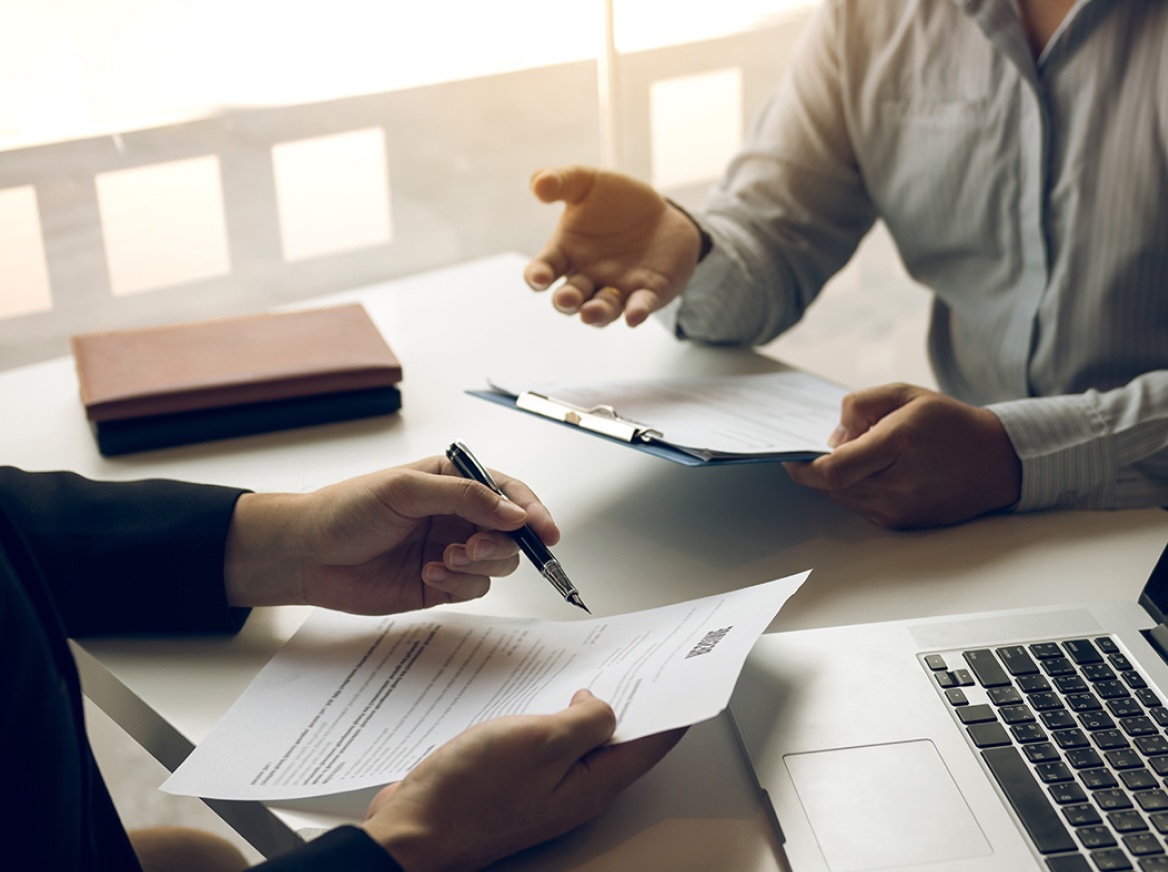 lawyer discussing documents with client